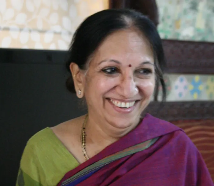 Jaishree Pankaj smiling, in a purple saree