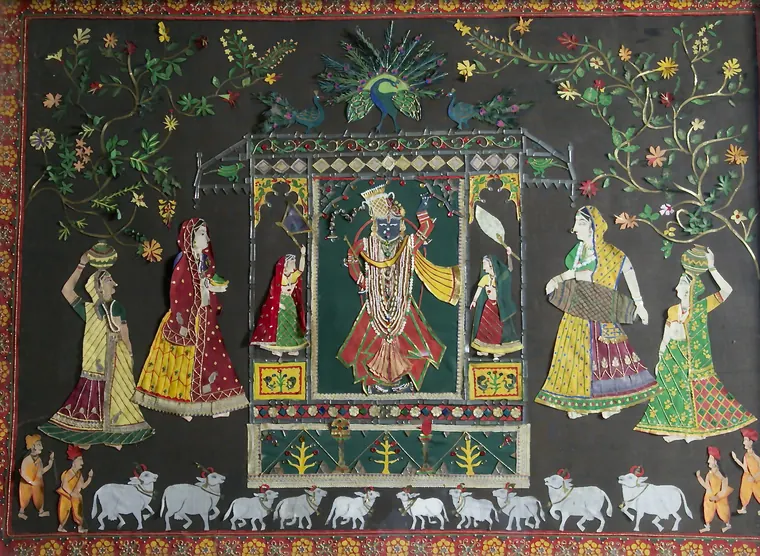 Shrinathji with the Gopis: a colourful cut-paper scene of Shrinathji under a canopy, with gopis and cows